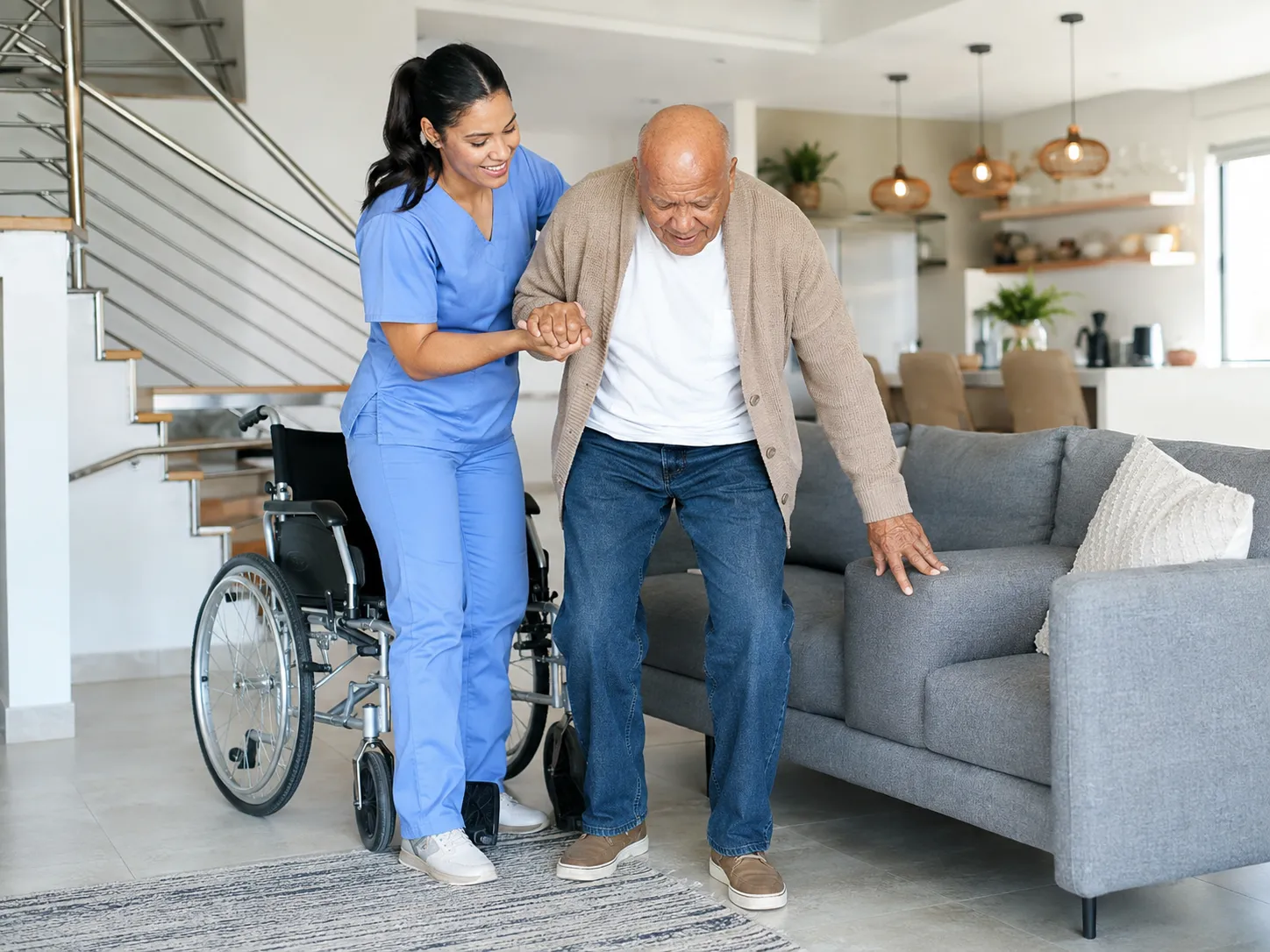 An LMCC caregiver helping a patient at home